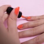 Girl polishing her nails