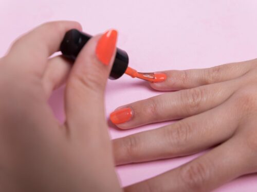 Girl polishing her nails