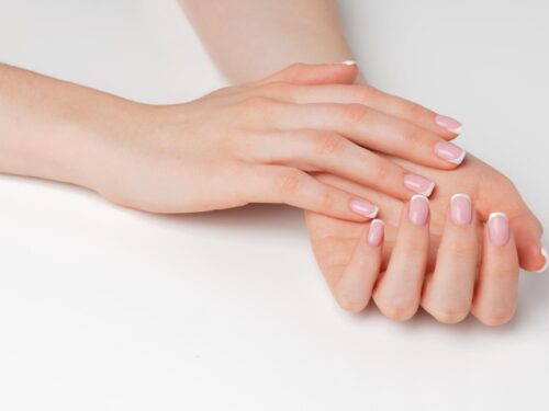 Well groomed female hands with manicure white (1)